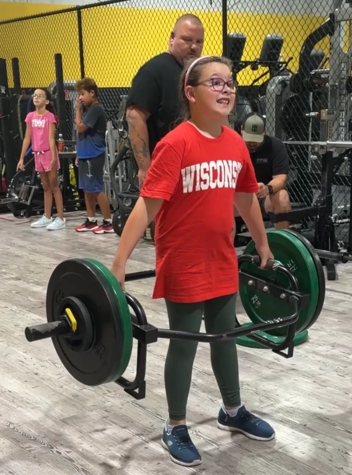 A young athlete deadlifting at Empire Gym