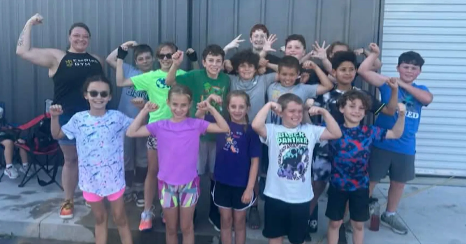 FitKids flexing outside Empire Gym
